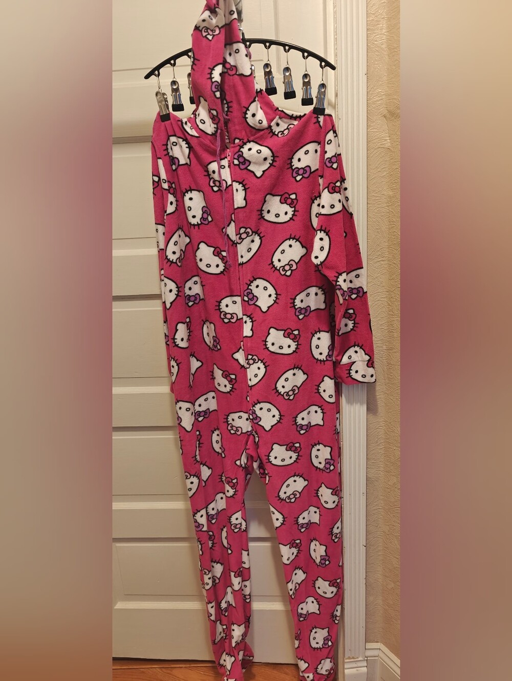 Pink Sanrio Hello Kitty fleece One Piece w all-over print of Hello Kitty's face